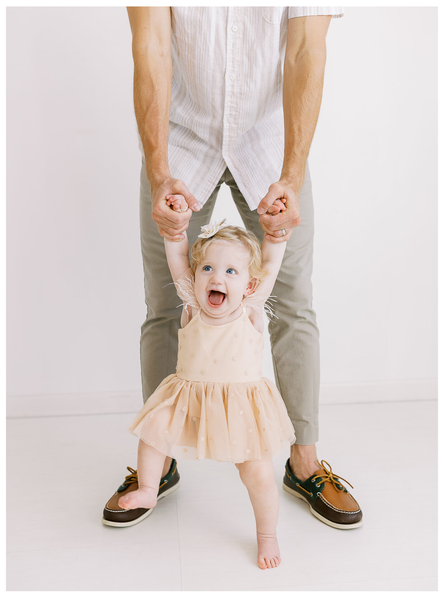 Winter Freire Photography | First birthday photos for baby girl in a photography studio with her father