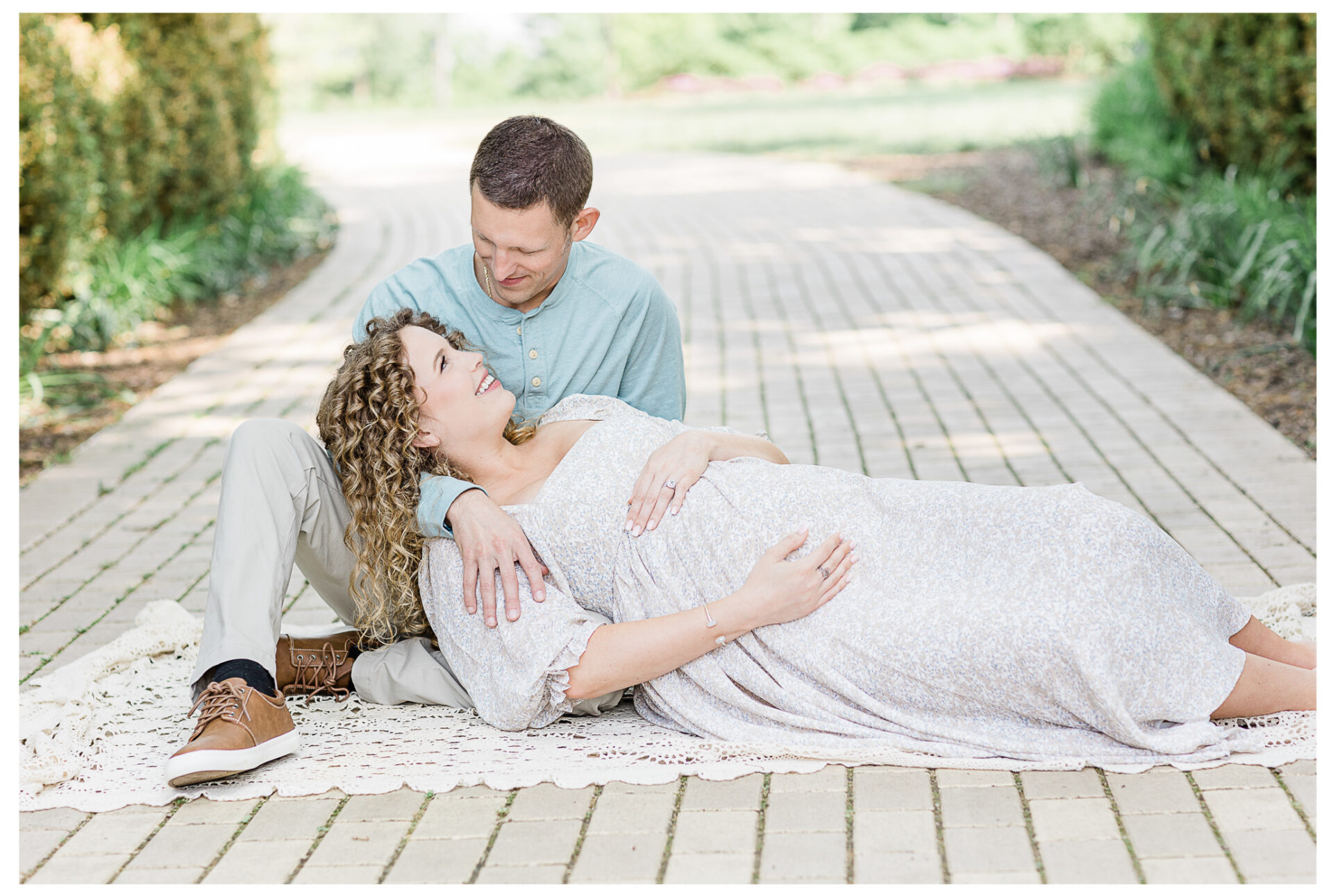 Winter Freire Photography | husband and wife smiling together at their outdoor maternity session