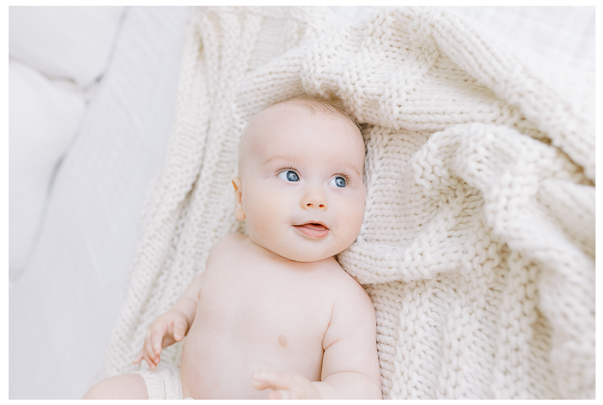 Winter Freire Photography | Dayton, Ohio Baby Milestone Session | Organic Family Studio Photography | 6 Month old baby laying on a soft blanket looking to the side