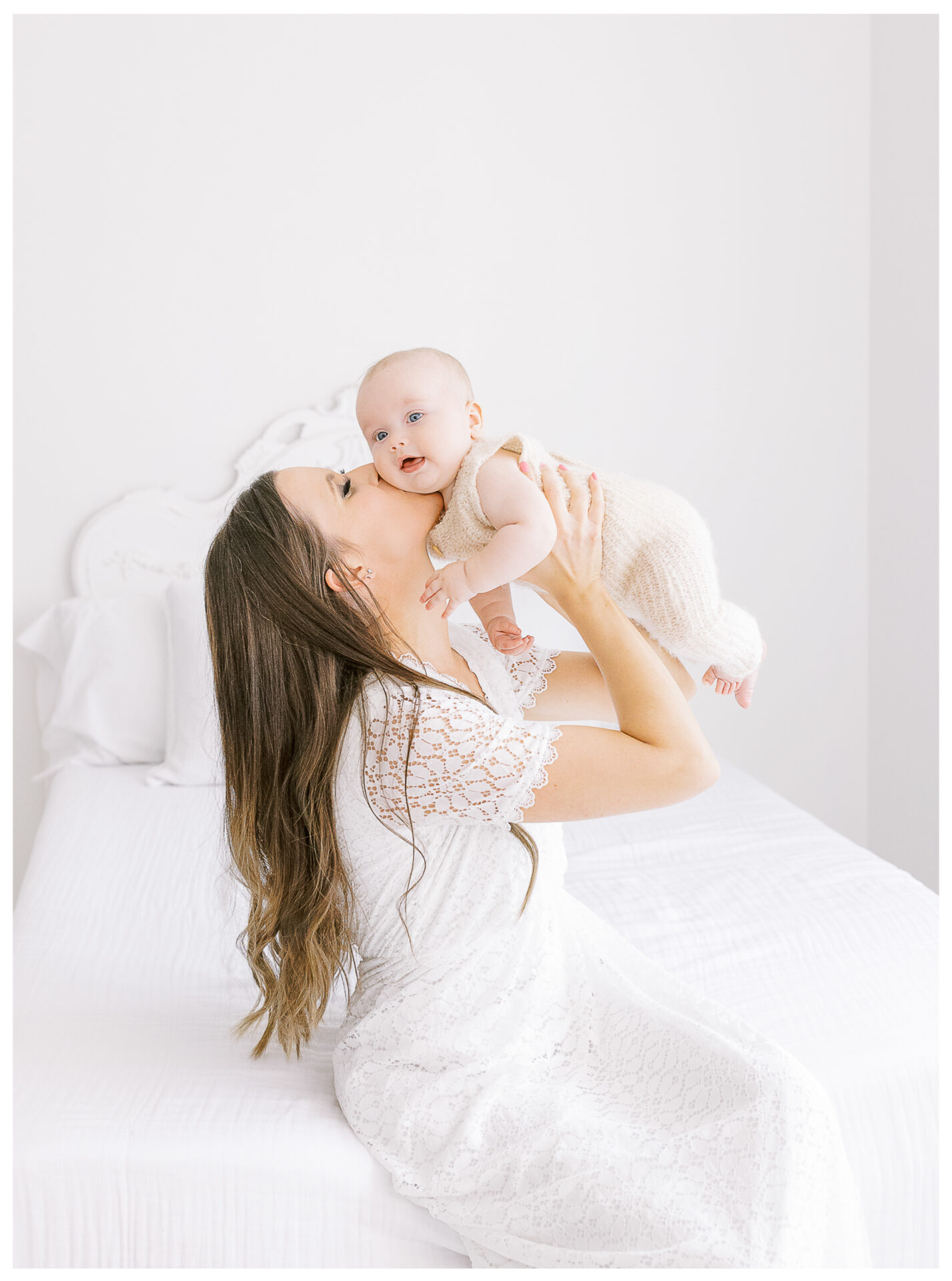 Winter Freire Photography | Dayton, Ohio Baby Milestone Session | Organic Family Studio Photography | 6 Month old baby being kissed by his mother