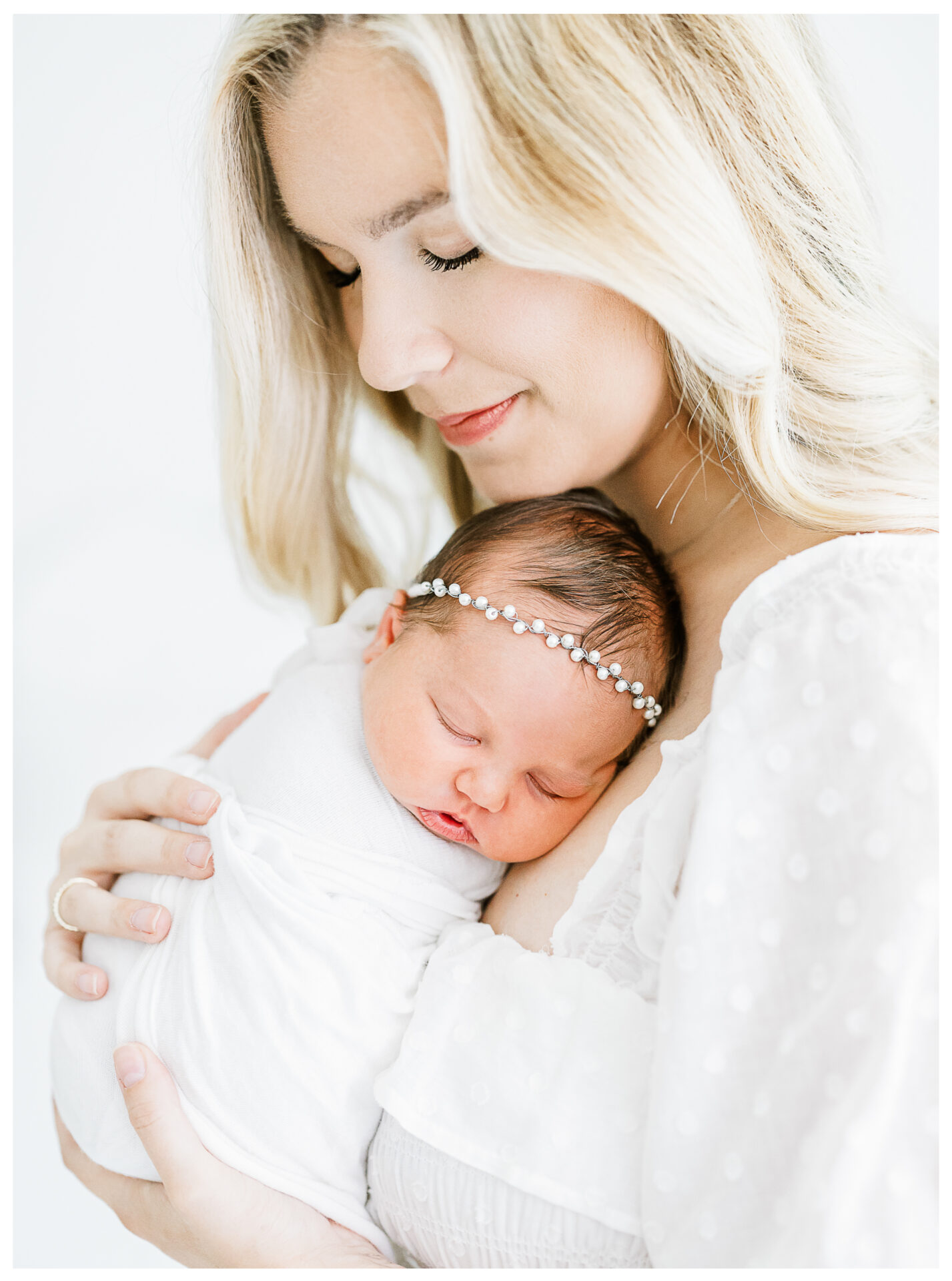 Winter Freire Photography | Dayton, Ohio Newborn Session | Mom standing while holding her newborn baby girl