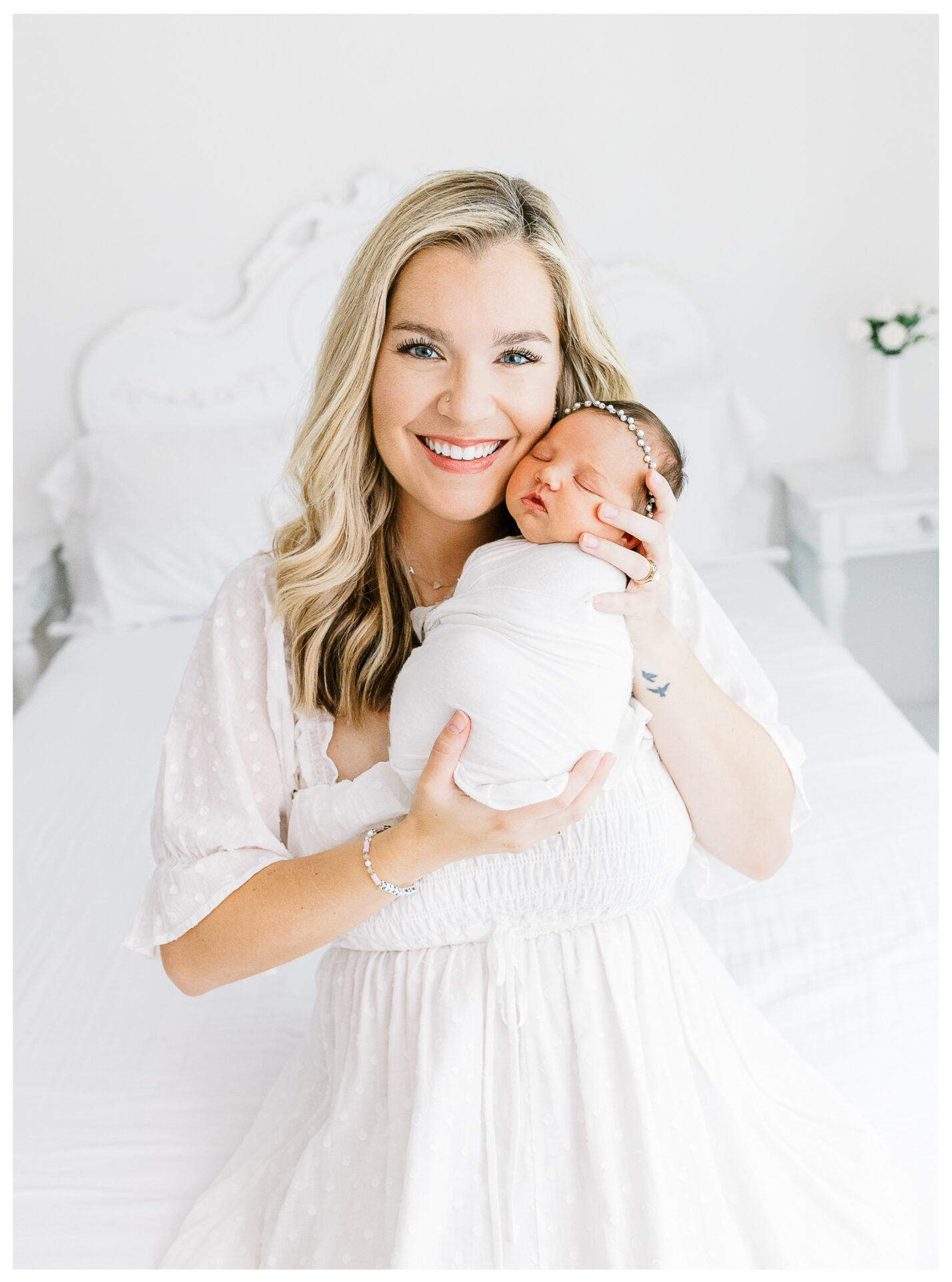 Winter Freire Photography | Dayton, Ohio Newborn Session | Mom sitting while holding her newborn baby girl