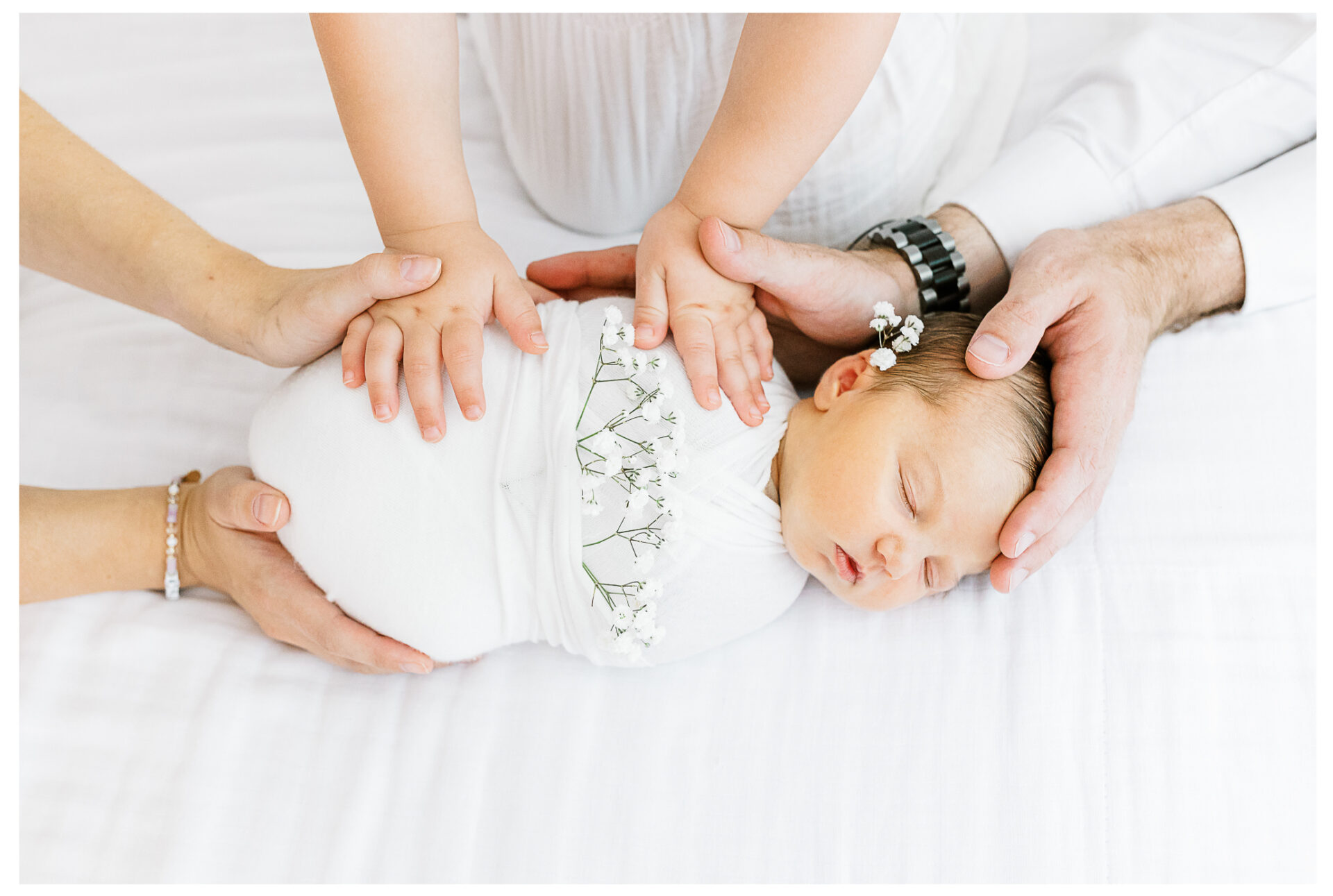 Winter Freire Photography | Dayton, Ohio Newborn Session | Closeup of the family's hands around their new baby girl