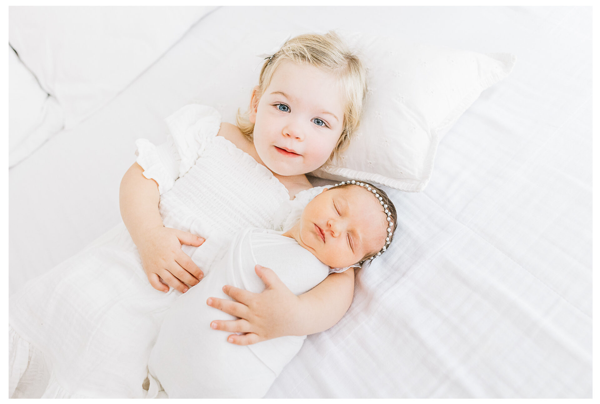 Winter Freire Photography | Dayton, Ohio Newborn Session | Toddler daughter laying beside her newborn sister