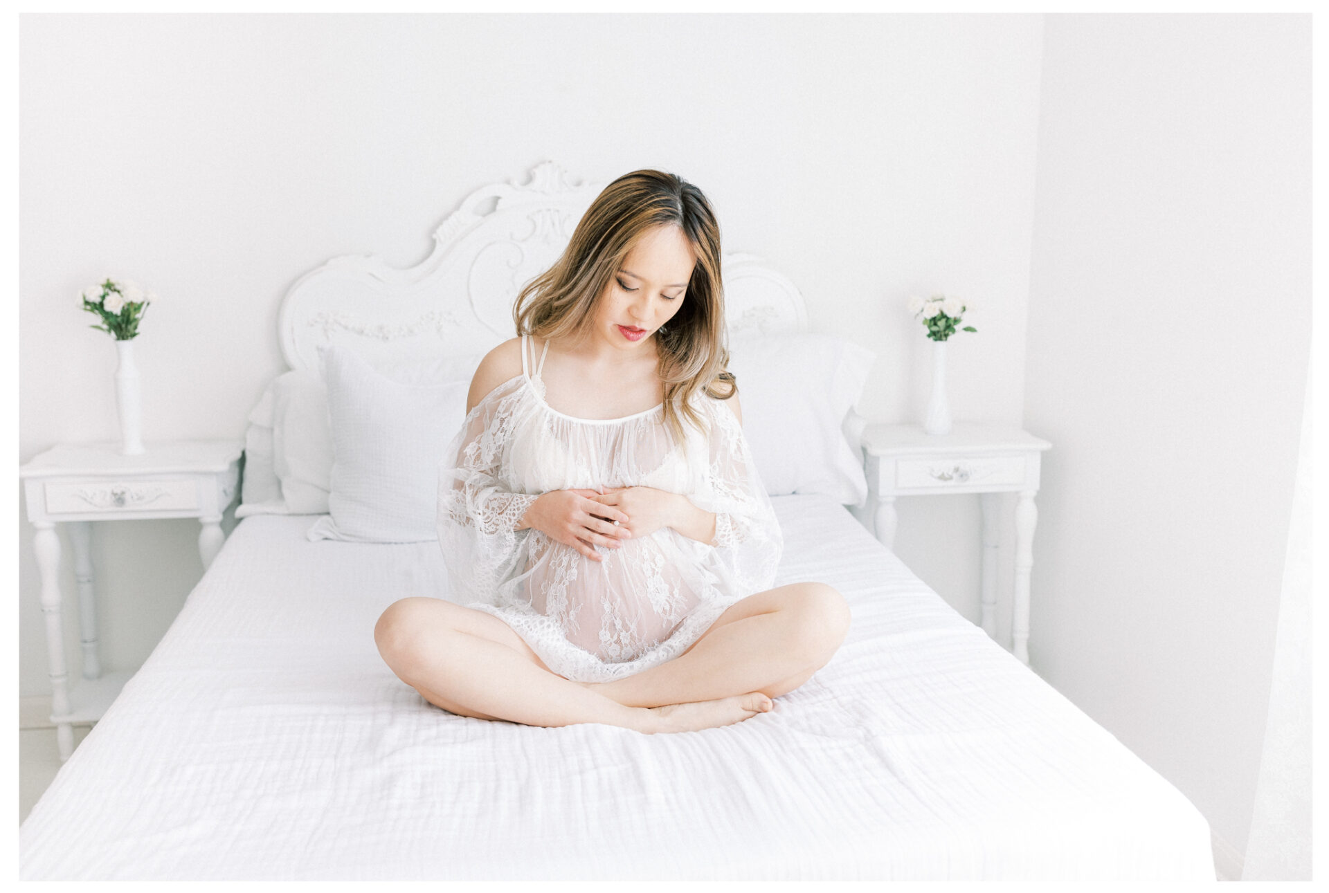 Winter Freire Photography | Fine Art Maternity Boudoir | Expecting mother sitting cross legged wearing a sheer lace dress