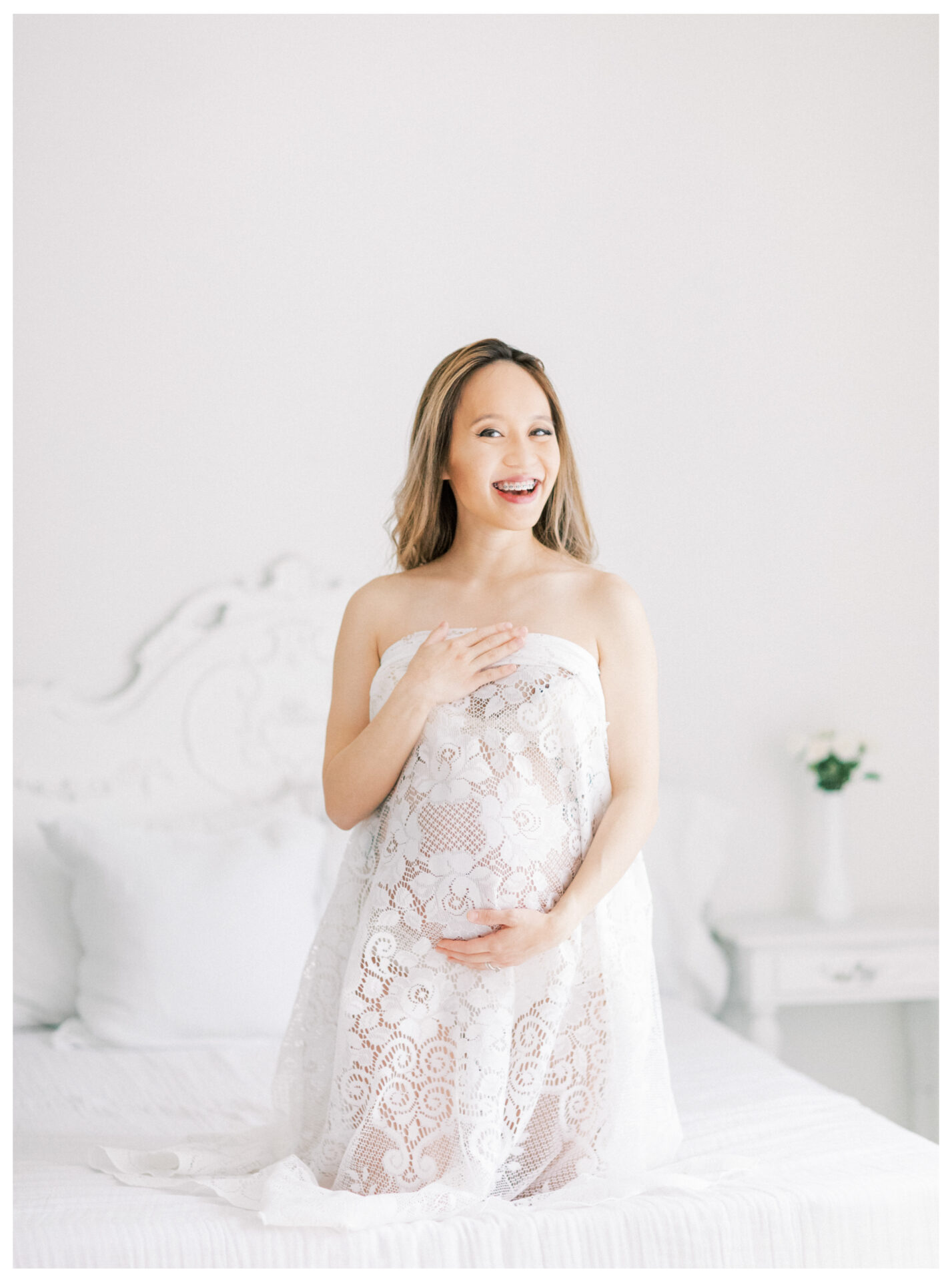 Winter Freire Photography | Fine Art Maternity Boudoir | Expecting mother holding vintage lace smiling