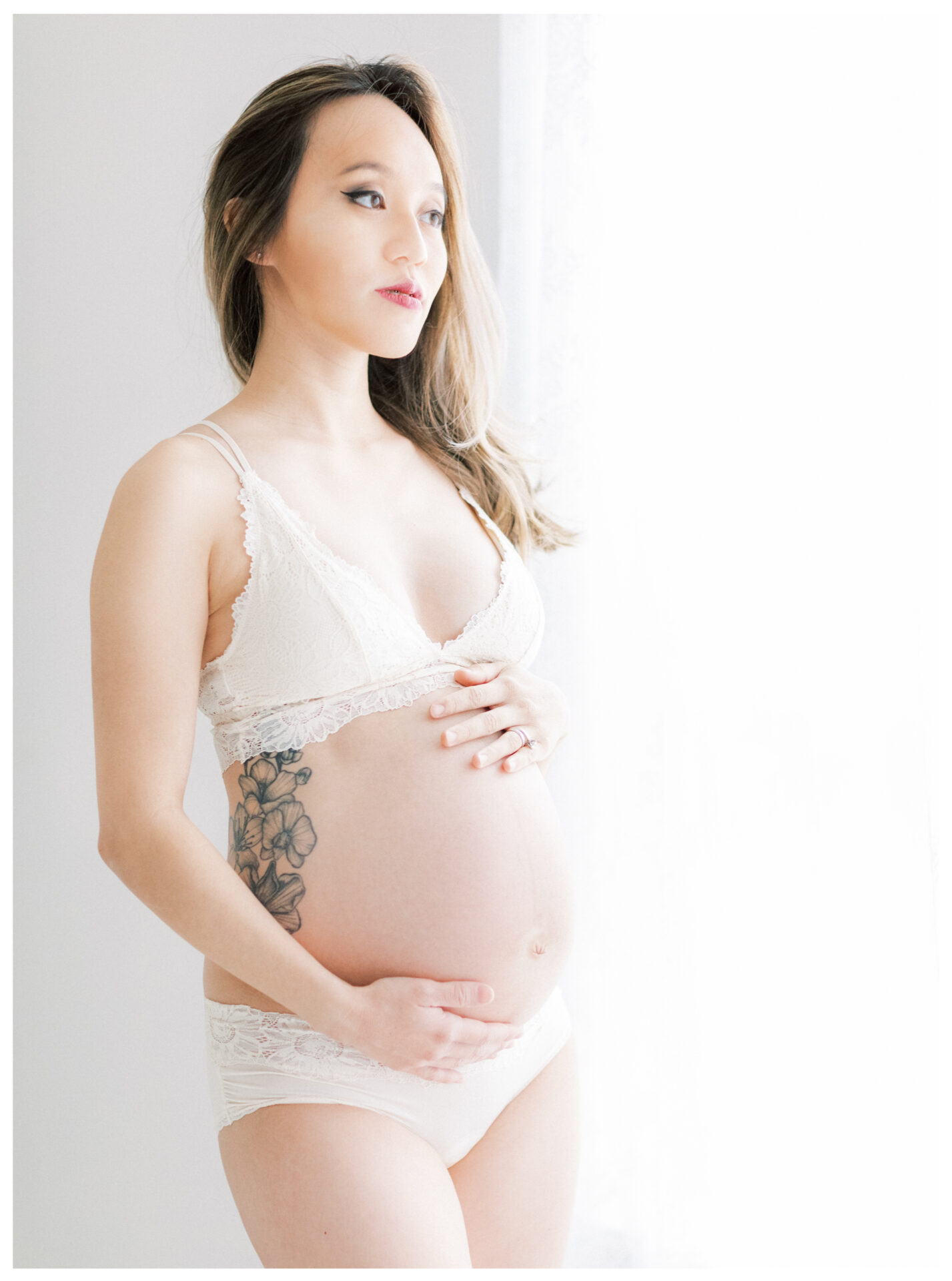 Winter Freire Photography | Fine Art Maternity Boudoir | Expecting mother standing in natural window light
