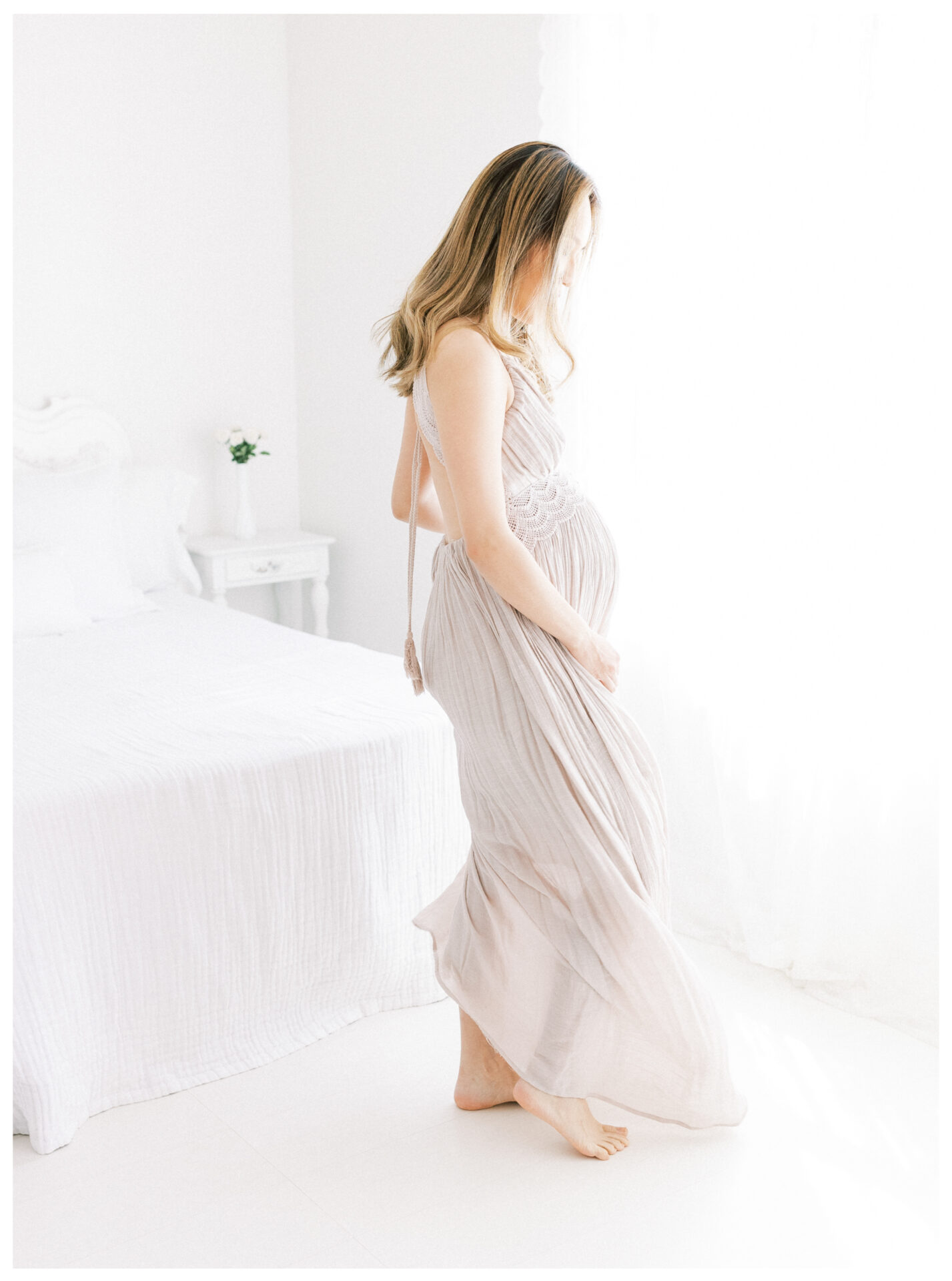 Winter Freire Photography | Fine Art Maternity Boudoir | Expecting mother twirling in a long dress
