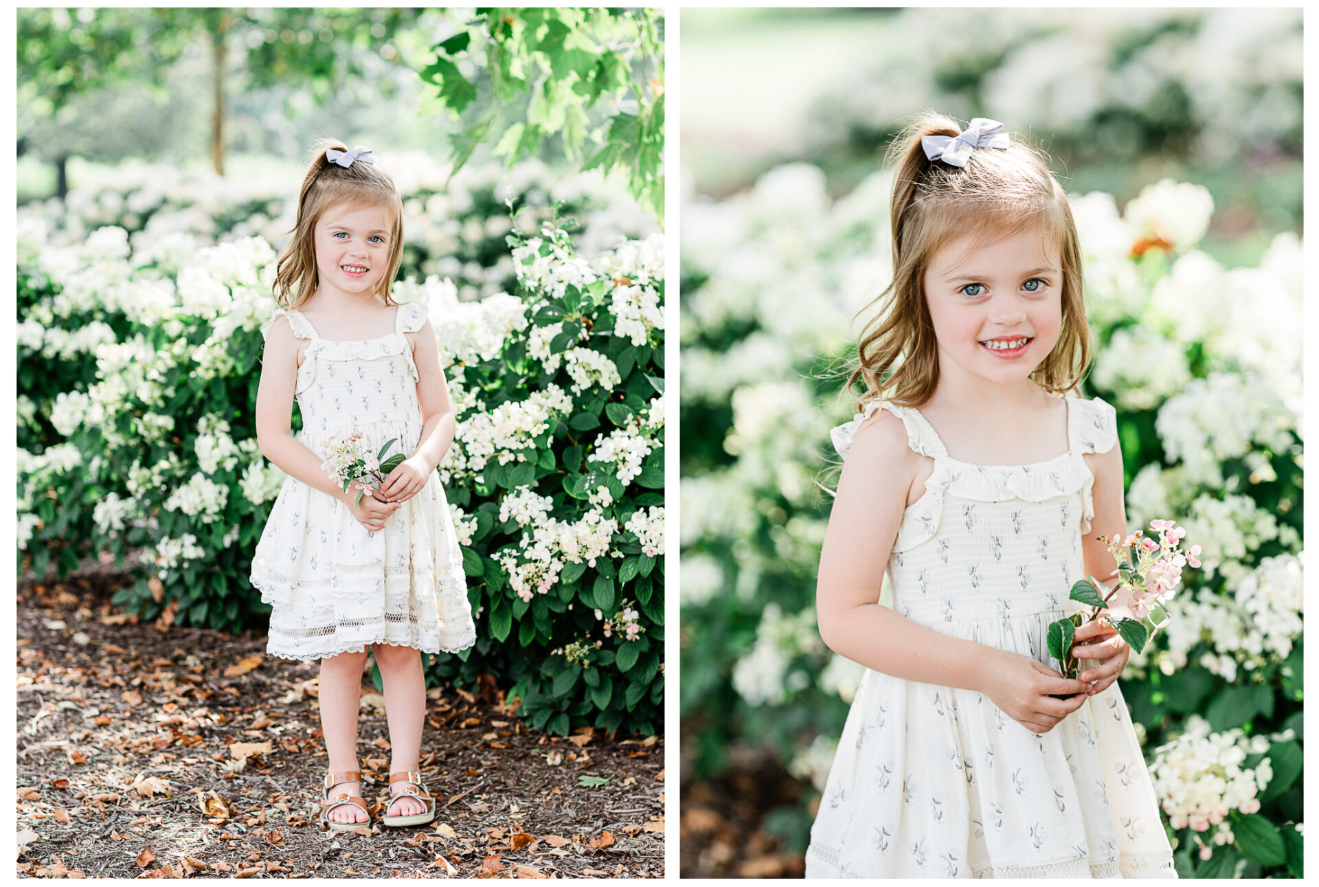 The big sister smiling while holding flowers.