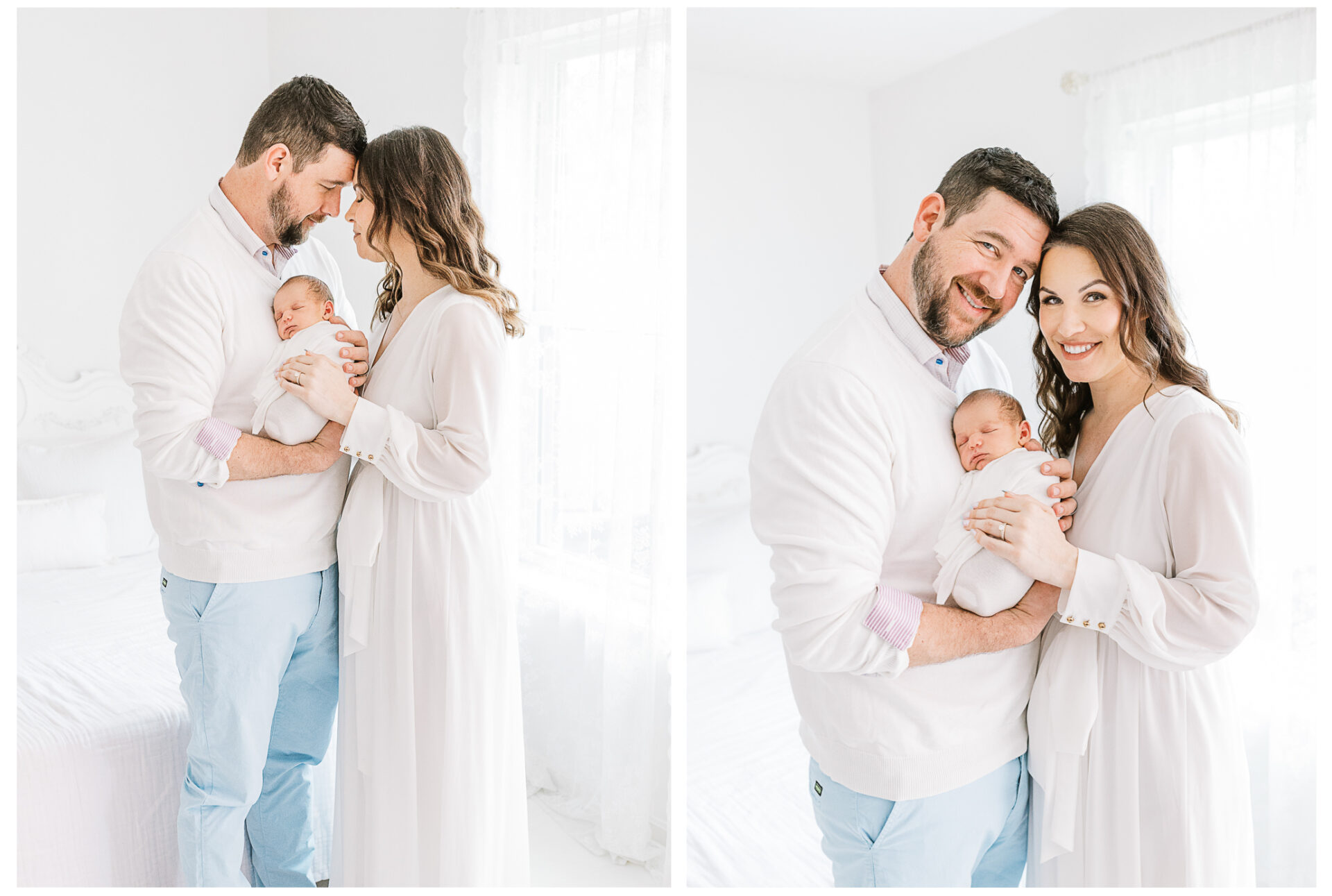 A husband and wife standing in the window light holding their newborn son between them.